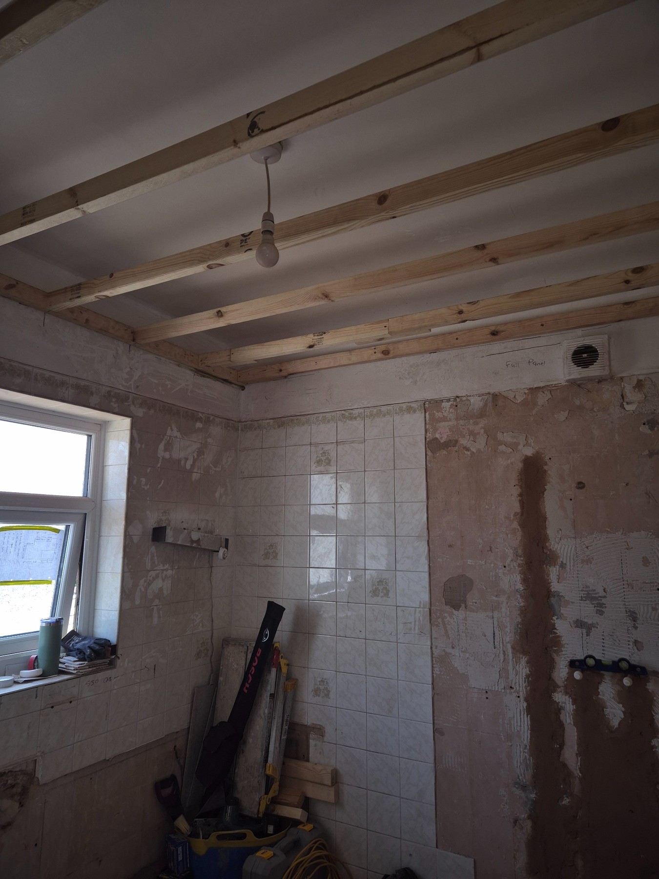 Bathroom walls and floor being prepared