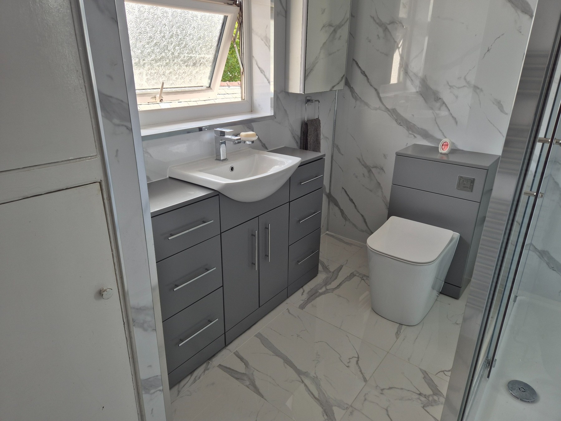 Completed modern bathroom renovation by MJ Bathrooms UK