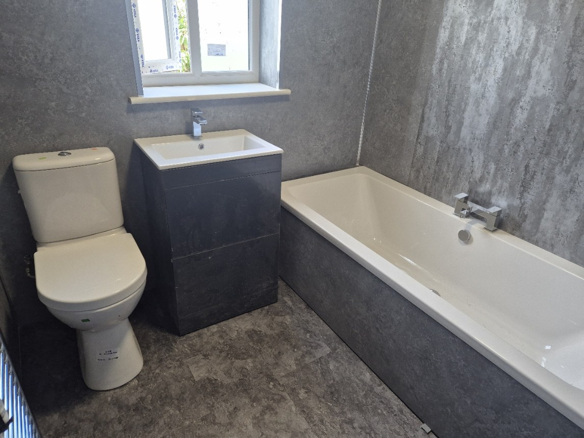 Finished grey bathroom installation