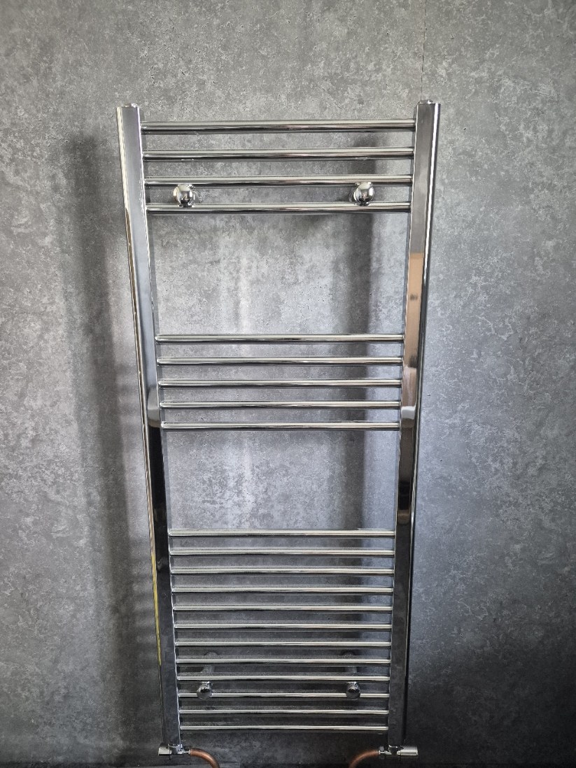 Chrome bathroom towel radiator installation