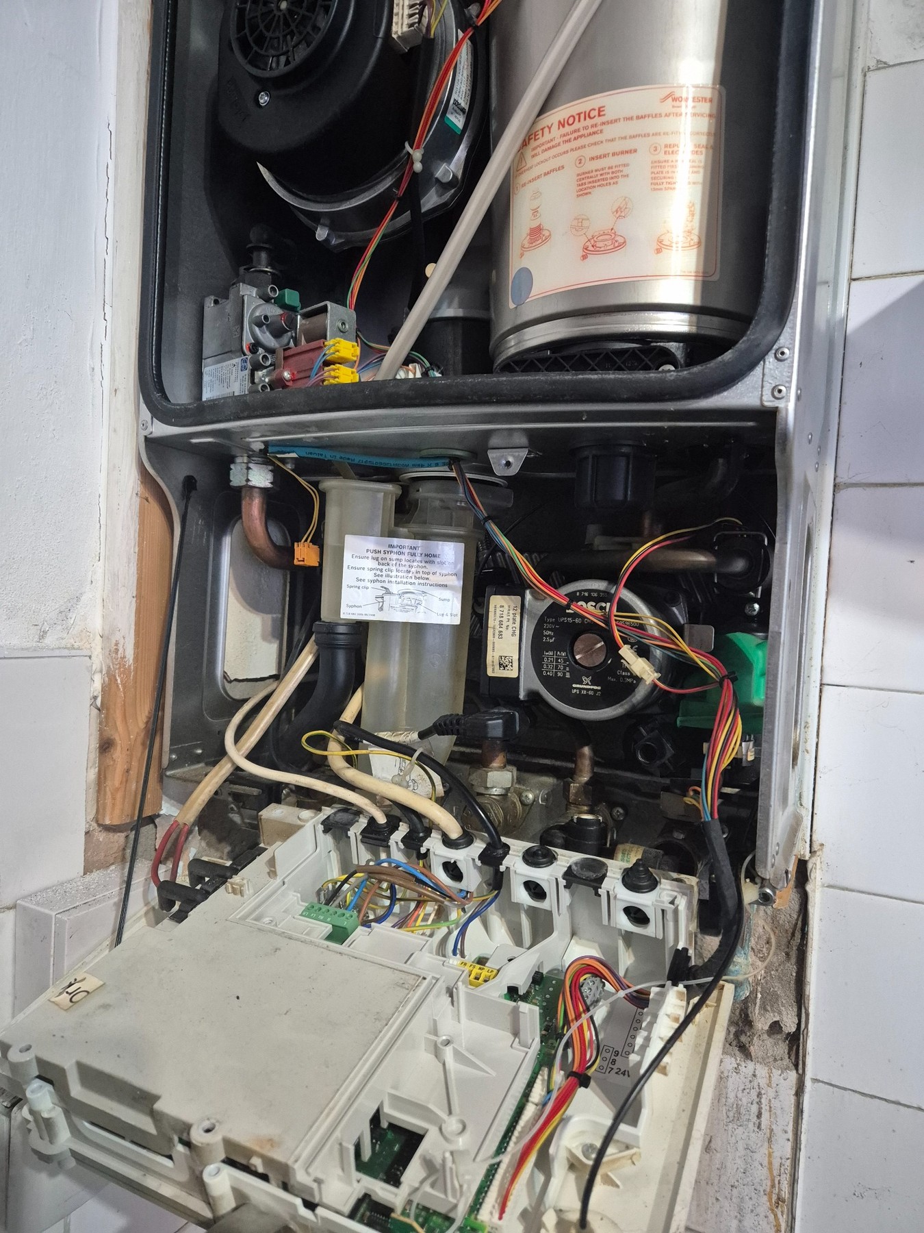 Gas boiler opened for servicing and inspection