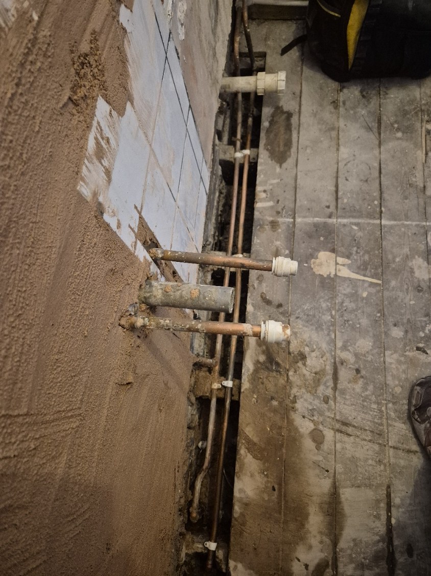 Hot, cold and waste connections positioned ready for the new basin