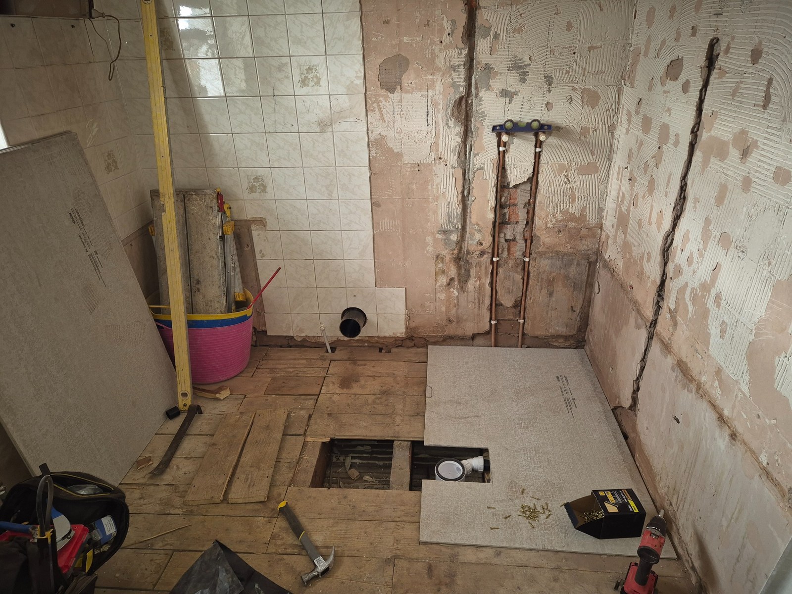 Existing ceiling removed to expose the structure above