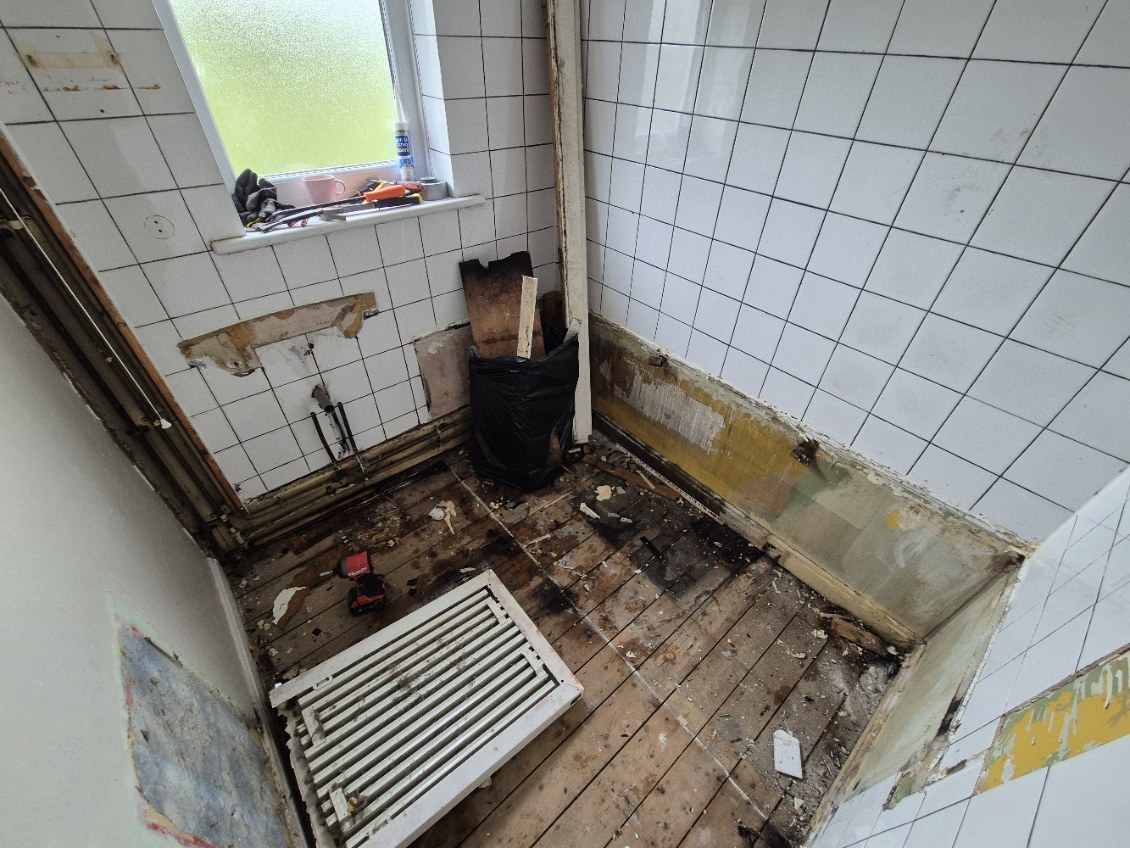 Old suite and floor finishes removed ready for the next stage