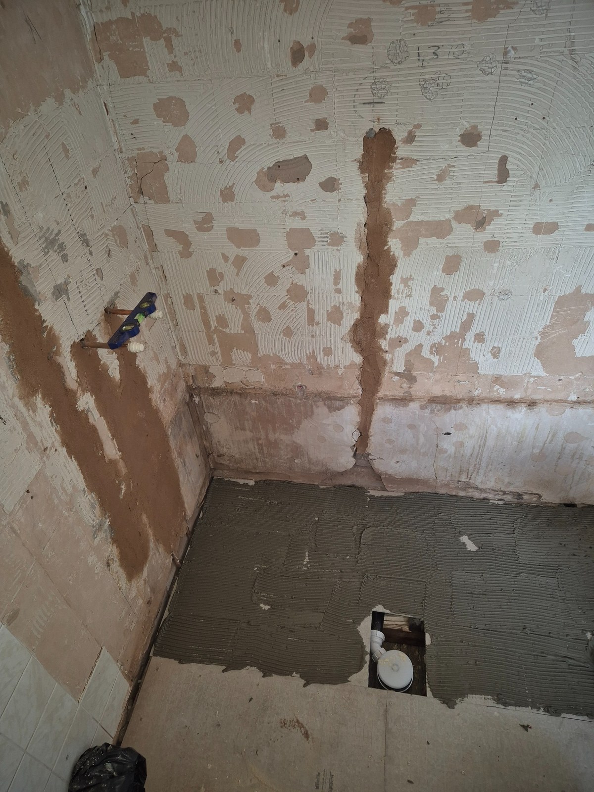 Old finishes removed around the window and service routes